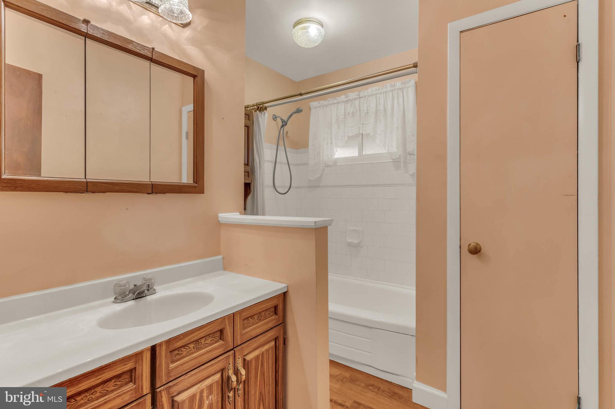 586 Rita Drive Odenton, MD 21113 - Photo 14 of 27 a bathroom with a sink and a mirror