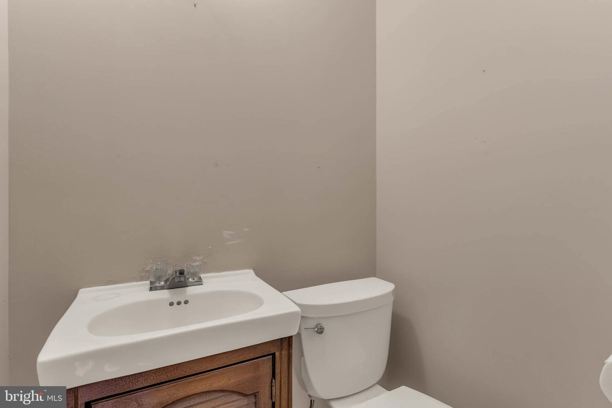 586 Rita Drive Odenton, MD 21113 - Photo 17 of 27 a bathroom with a sink a toilet and mirror