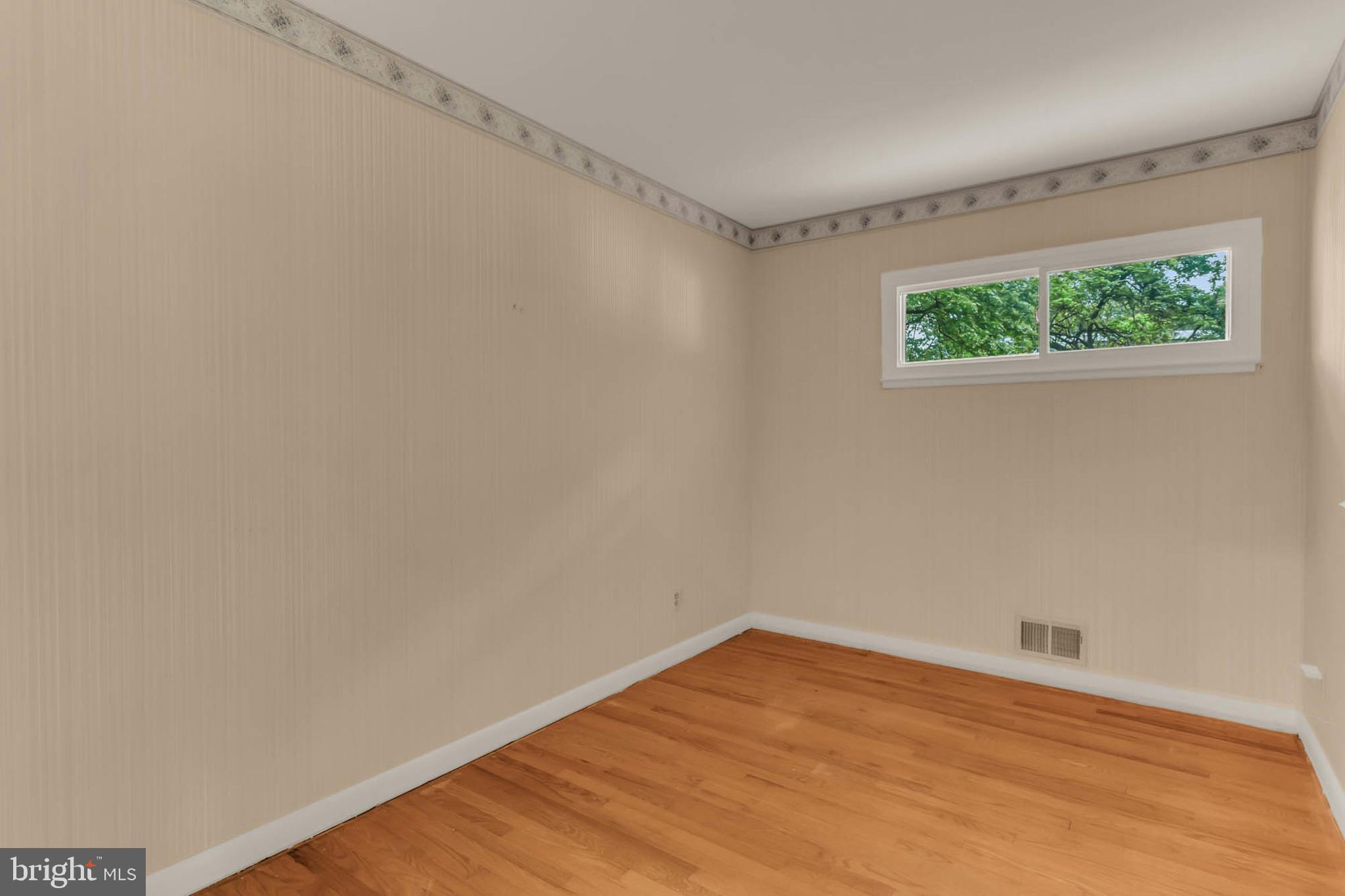 586 Rita Drive Odenton, MD 21113 - Photo 18 of 27 a view of an empty room with wooden floor