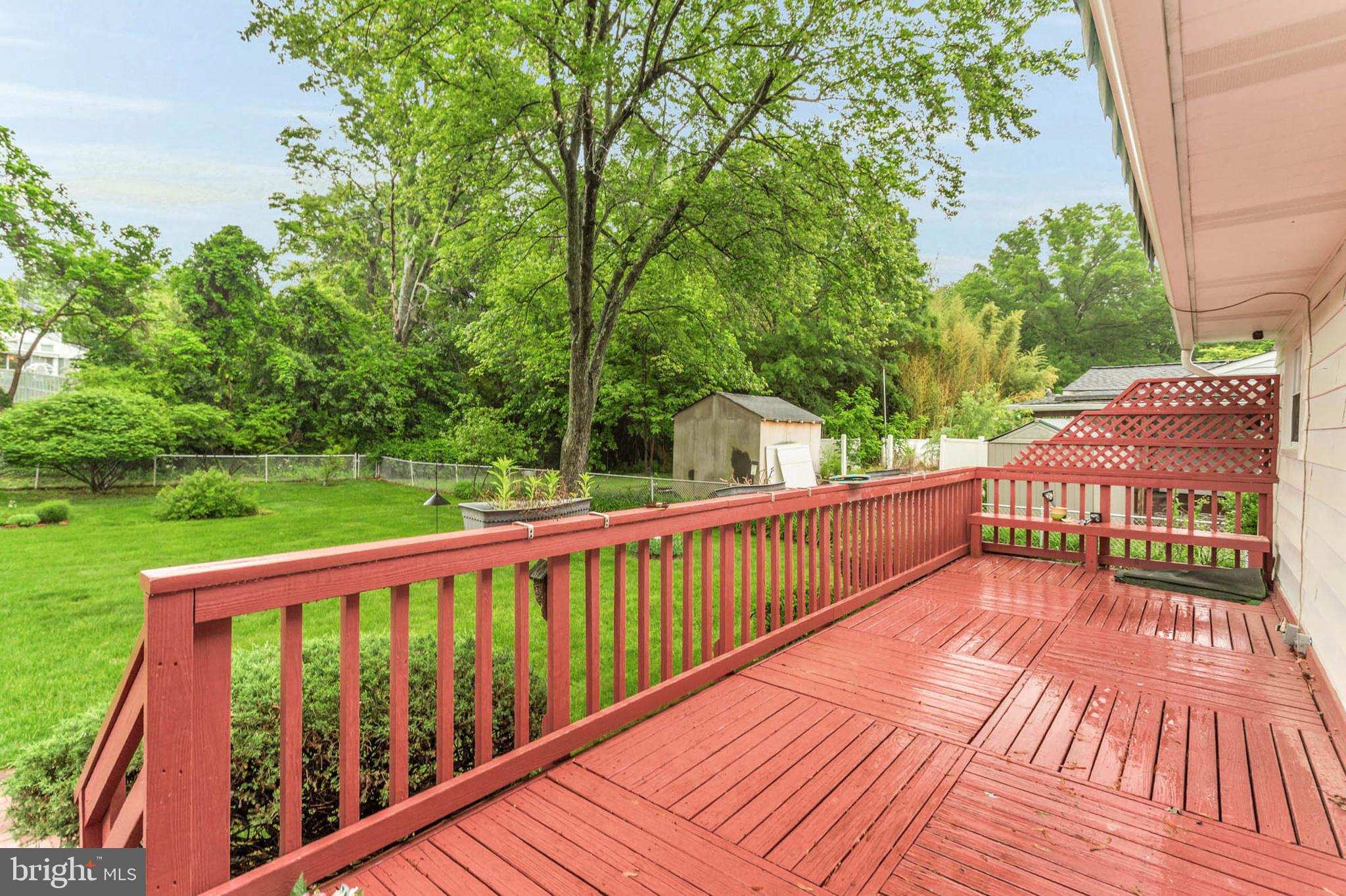 586 Rita Drive Odenton, MD 21113 - Photo 2 of 27 a view of balcony with wooden floor and fence