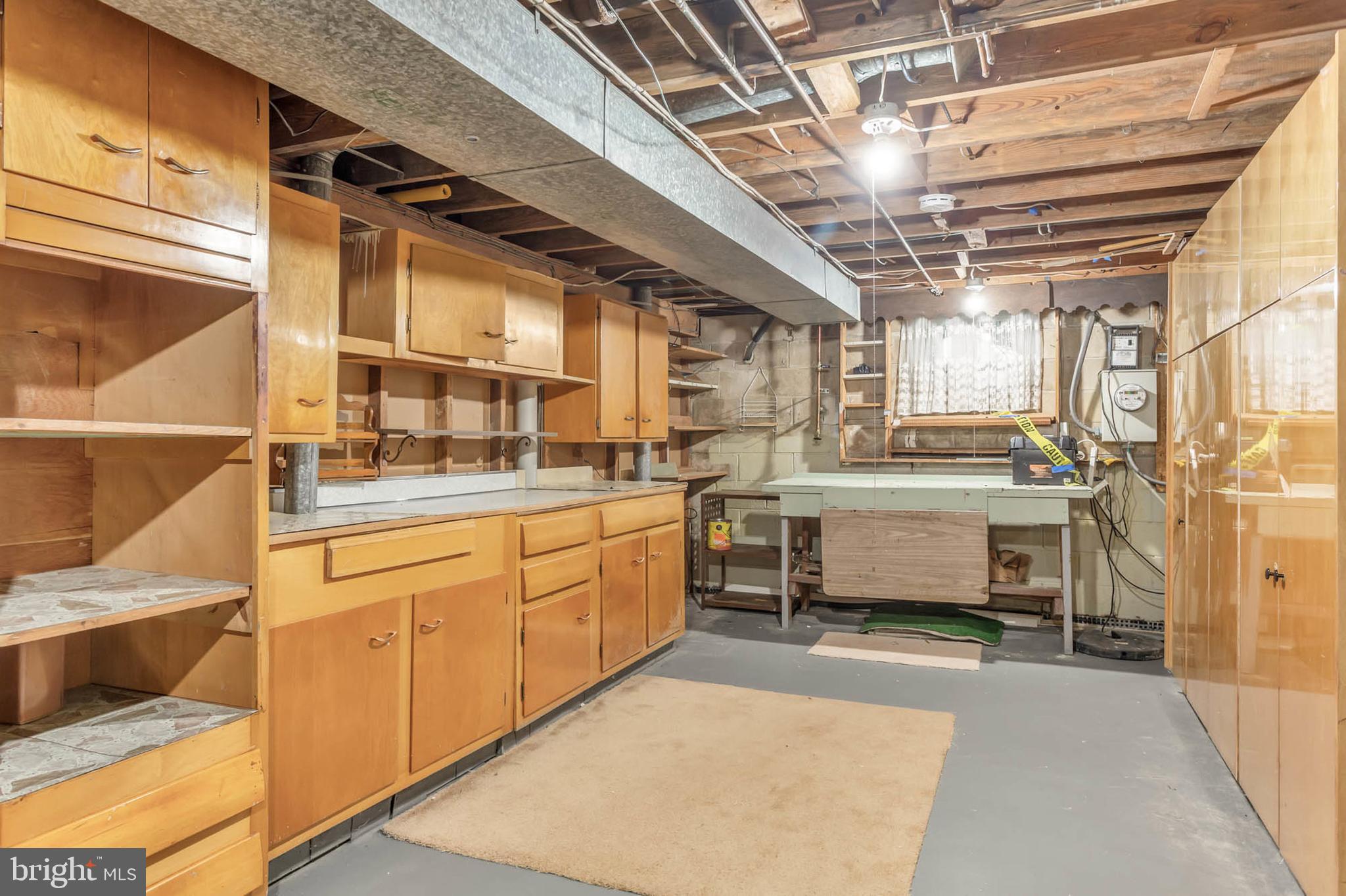 586 Rita Drive Odenton, MD 21113 - Photo 23 of 27 a utility room with stainless steel appliances kitchen island granite countertop a sink and cabinets