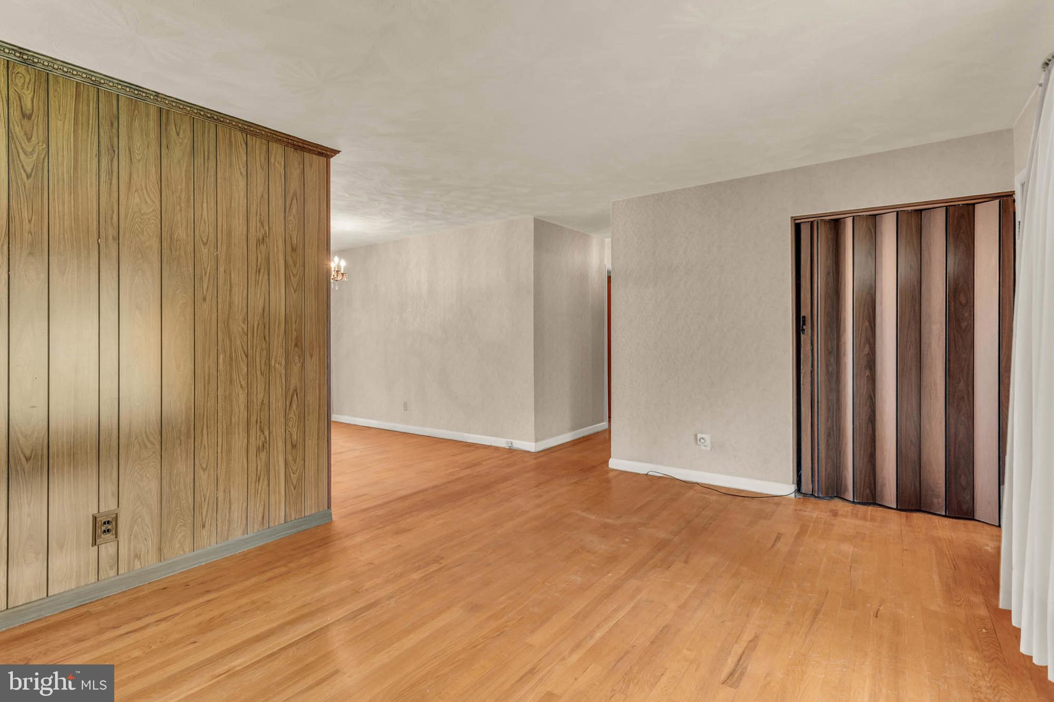 586 Rita Drive Odenton, MD 21113 - Photo 6 of 27 a view of an empty room with wooden floor