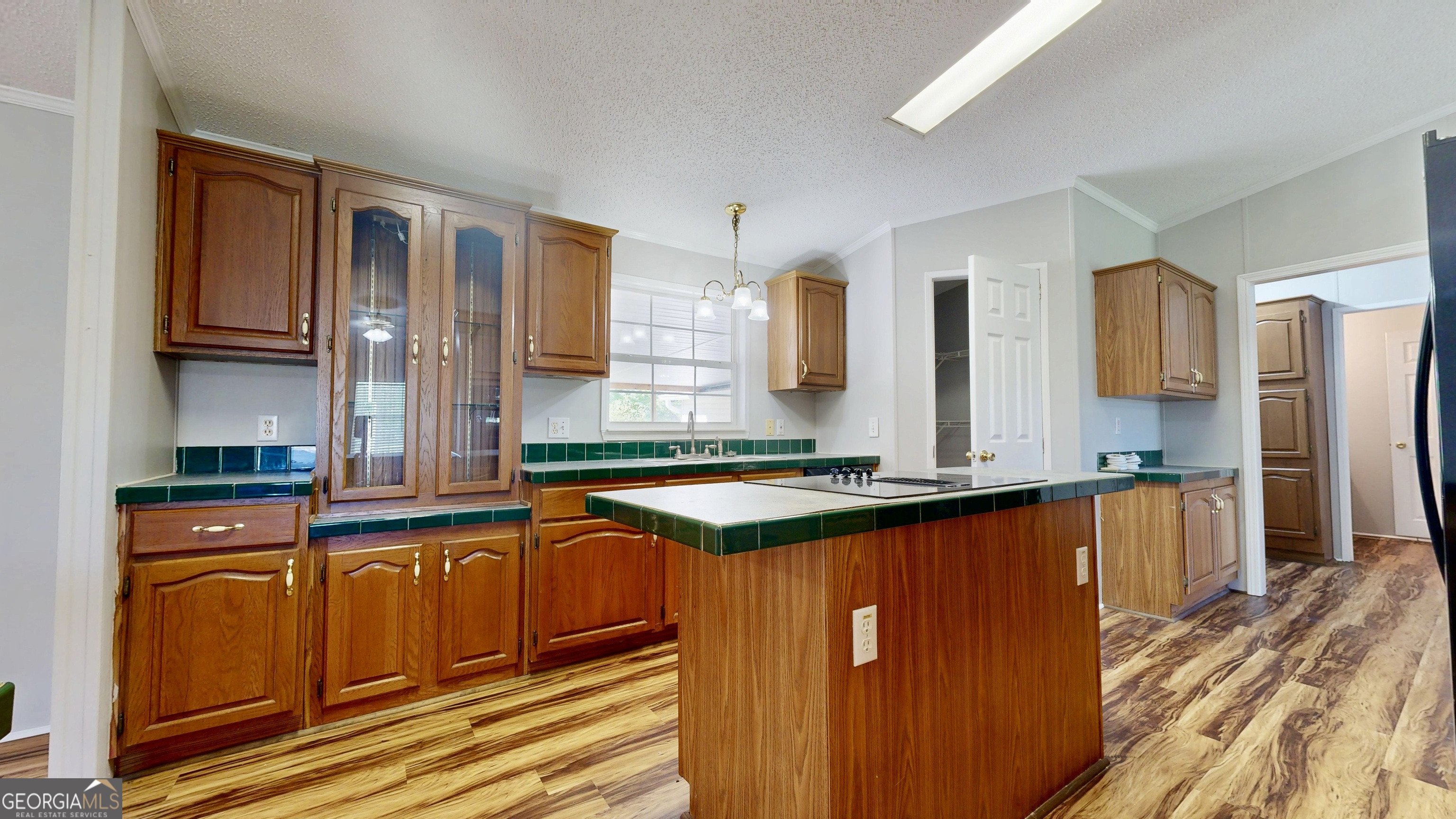 6498 Central Avenue Waycross, GA 31503 - Photo 2 of 20 a kitchen with stainless steel appliances granite countertop a sink stove and refrigerator