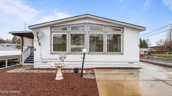 a front view of a house with patio