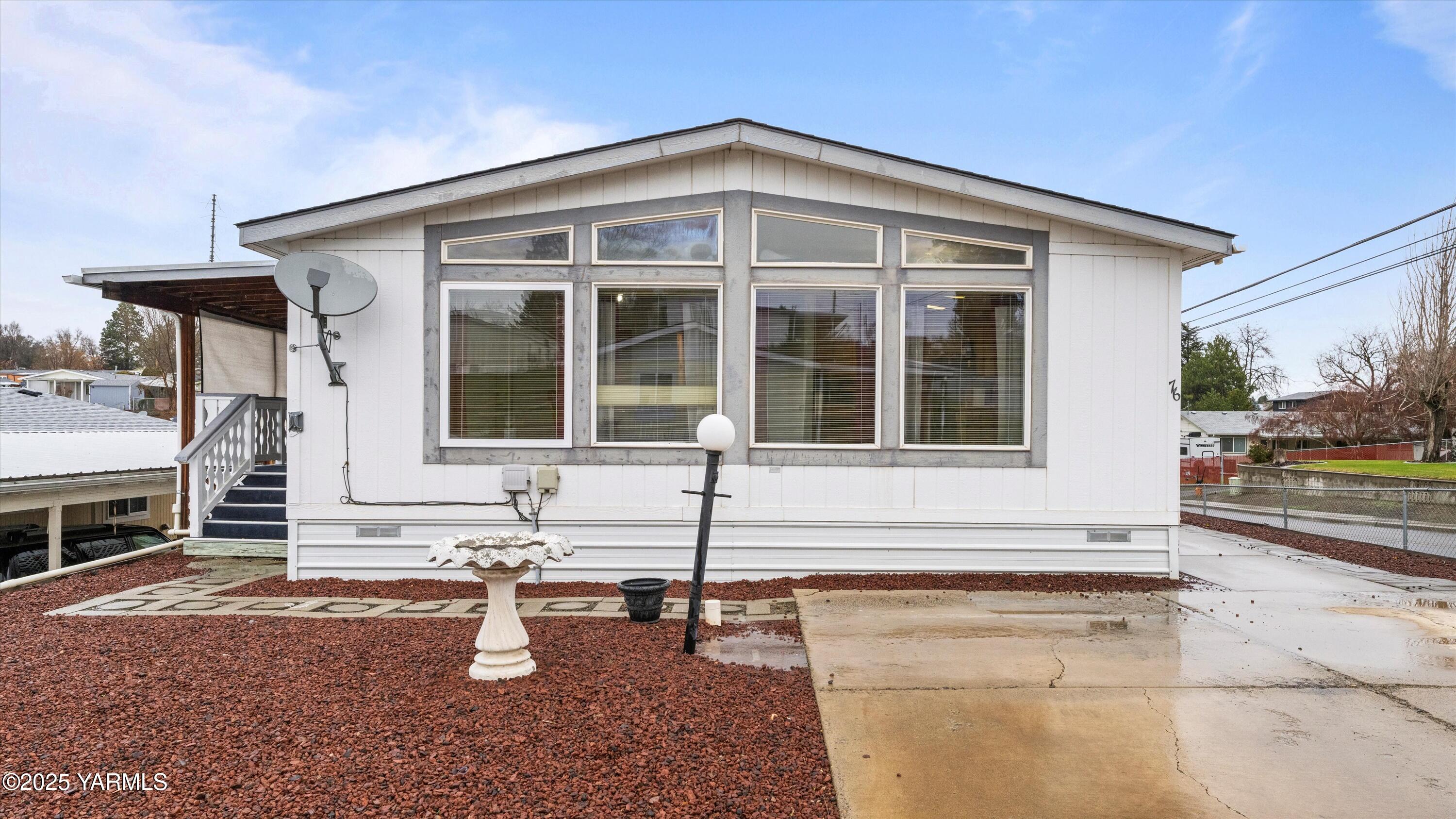 1200 Euclid Street, Unit 76 Grandview, WA 98930 - Photo 11 of 25 a front view of a house with patio
