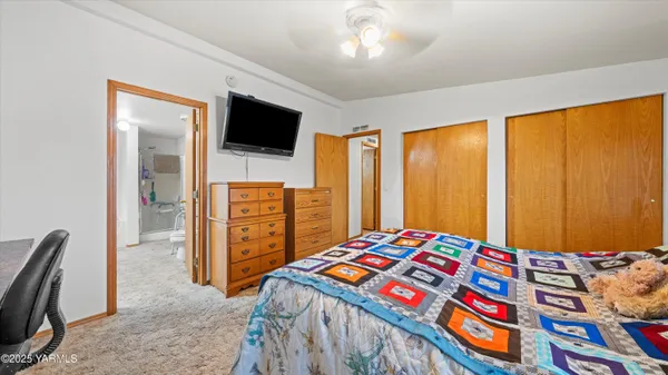 a bedroom with a bed and furniture