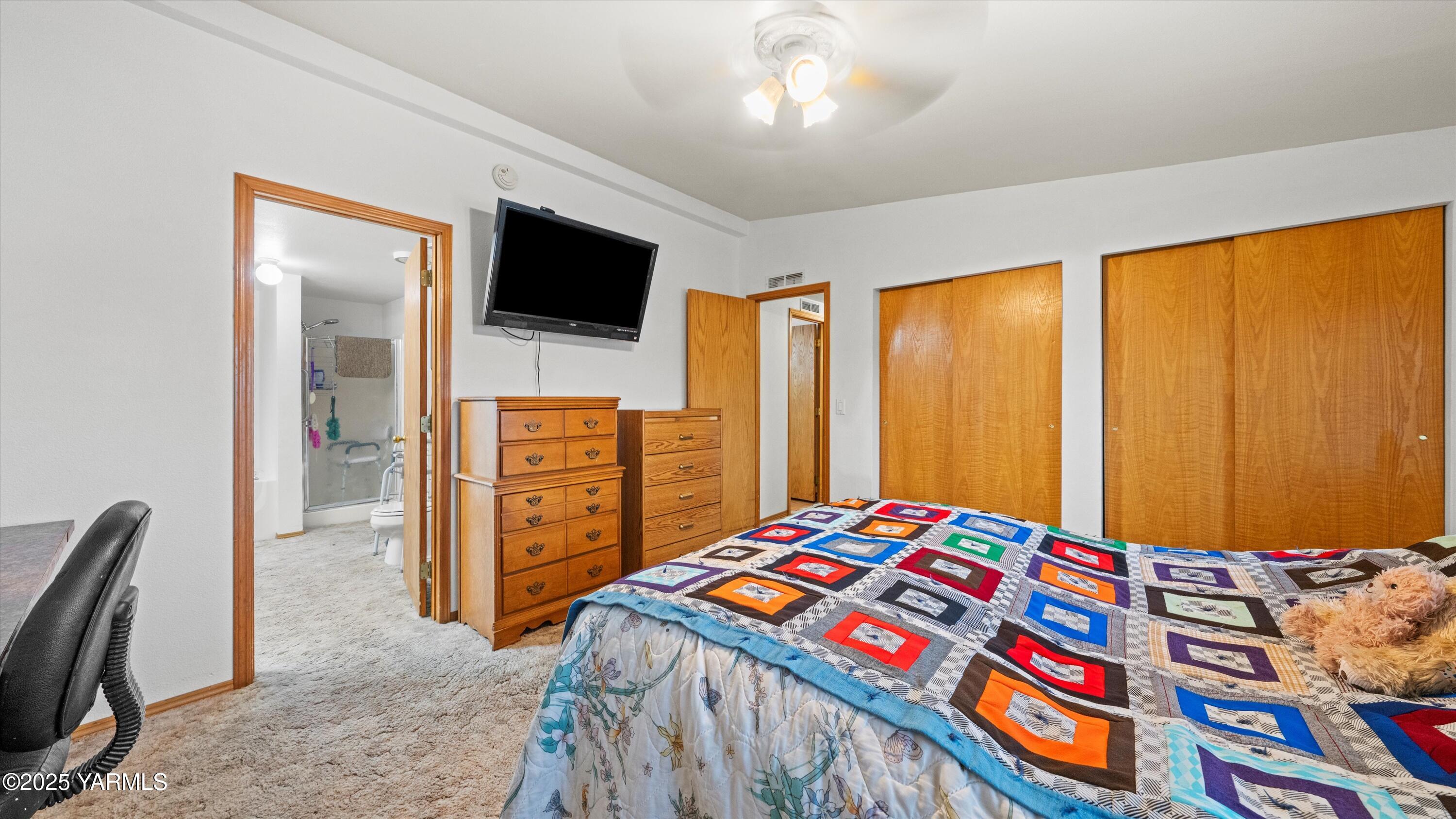 1200 Euclid Street, Unit 76 Grandview, WA 98930 - Photo 20 of 25 a bedroom with a bed and furniture