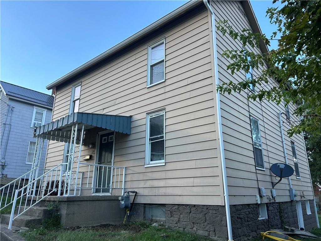 25 East Craig Street Uniontown, PA 15401 - Photo 2 of 18 a front view of a house with a yard