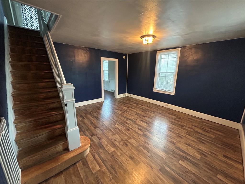 25 East Craig Street Uniontown, PA 15401 - Photo 4 of 18 a view of an empty room with wooden floor and windows