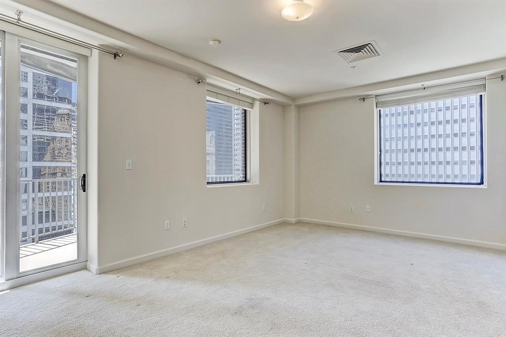 914 Main Street, Unit 1806 Houston, TX 77002 - Photo 4 of 21 a view of an empty room with a window