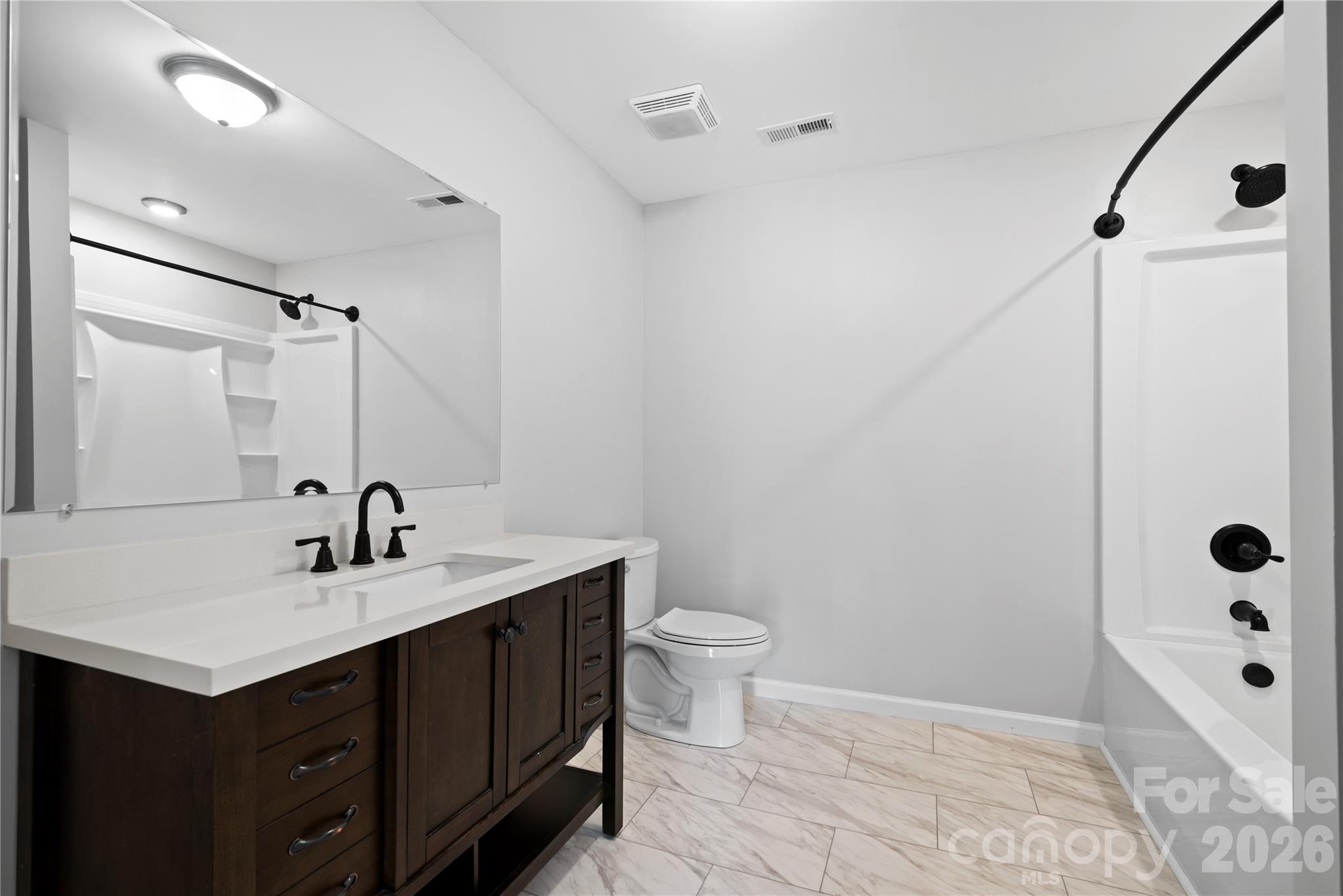 648 Scotts Creek Road Statesville, NC 28625 - Photo 13 of 17 a bathroom with a sink and a mirror