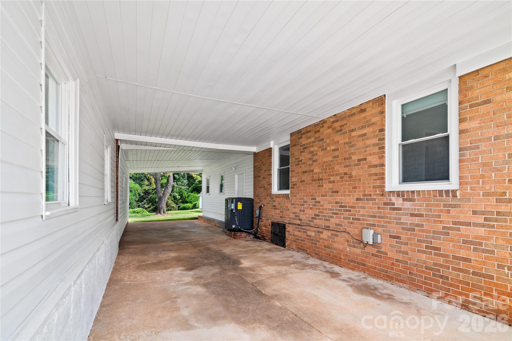 648 Scotts Creek Road Statesville, NC 28625 - Photo 15 of 17 a view of empty room with a fireplace and windows