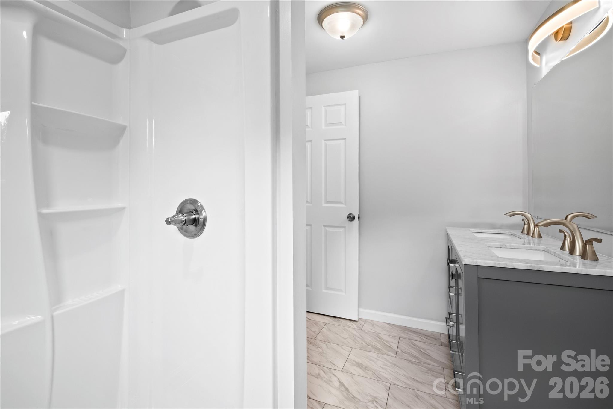 648 Scotts Creek Road Statesville, NC 28625 - Photo 10 of 17 a bathroom with a sink and mirror