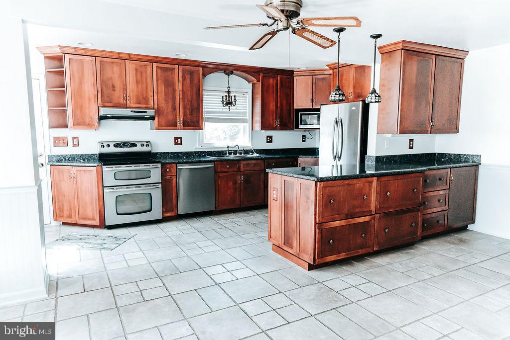 21128 Sparta Road Milford, VA 22514 - Photo 18 of 48 kitchen granite counters and ceramic floors