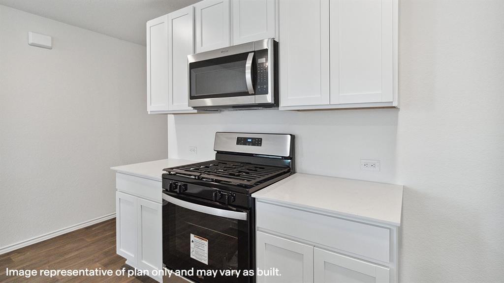 1824 Potomac Lane Blue Ridge, TX 75424 - Photo 5 of 29 a kitchen with stainless steel appliances granite countertop white cabinets a stove top oven