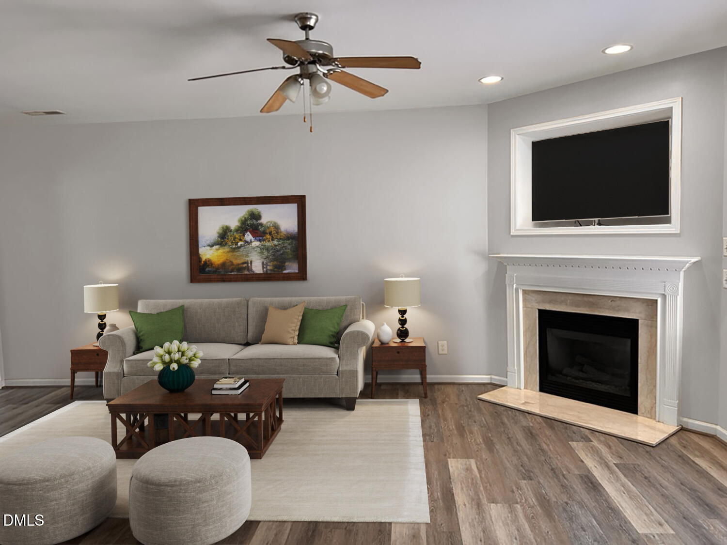 a living room with furniture a flat screen tv and a fireplace