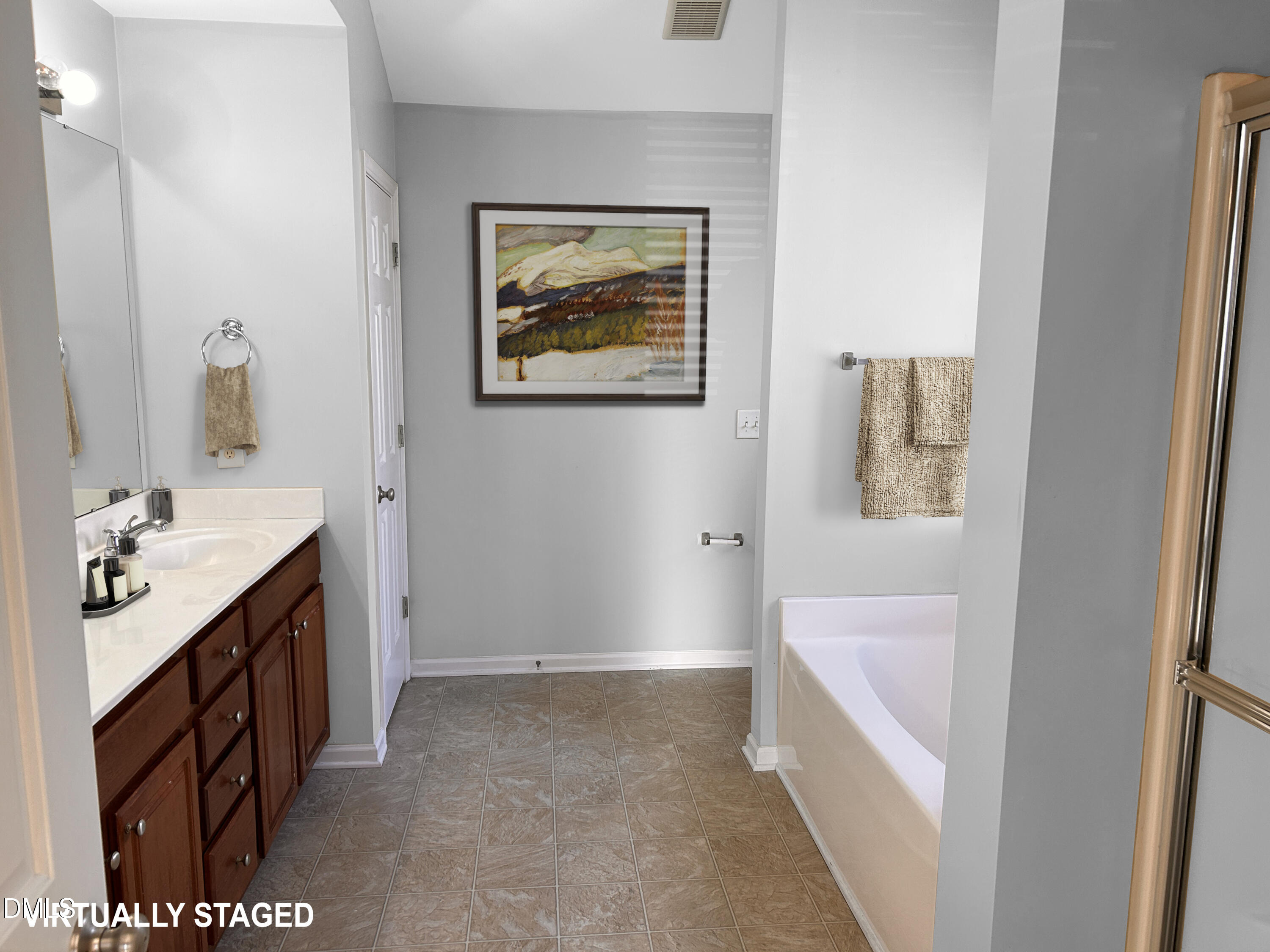 3920 Cane Garden Drive Raleigh, NC 27610 - Photo 12 of 23 a bathroom with a tub sink and mirror
