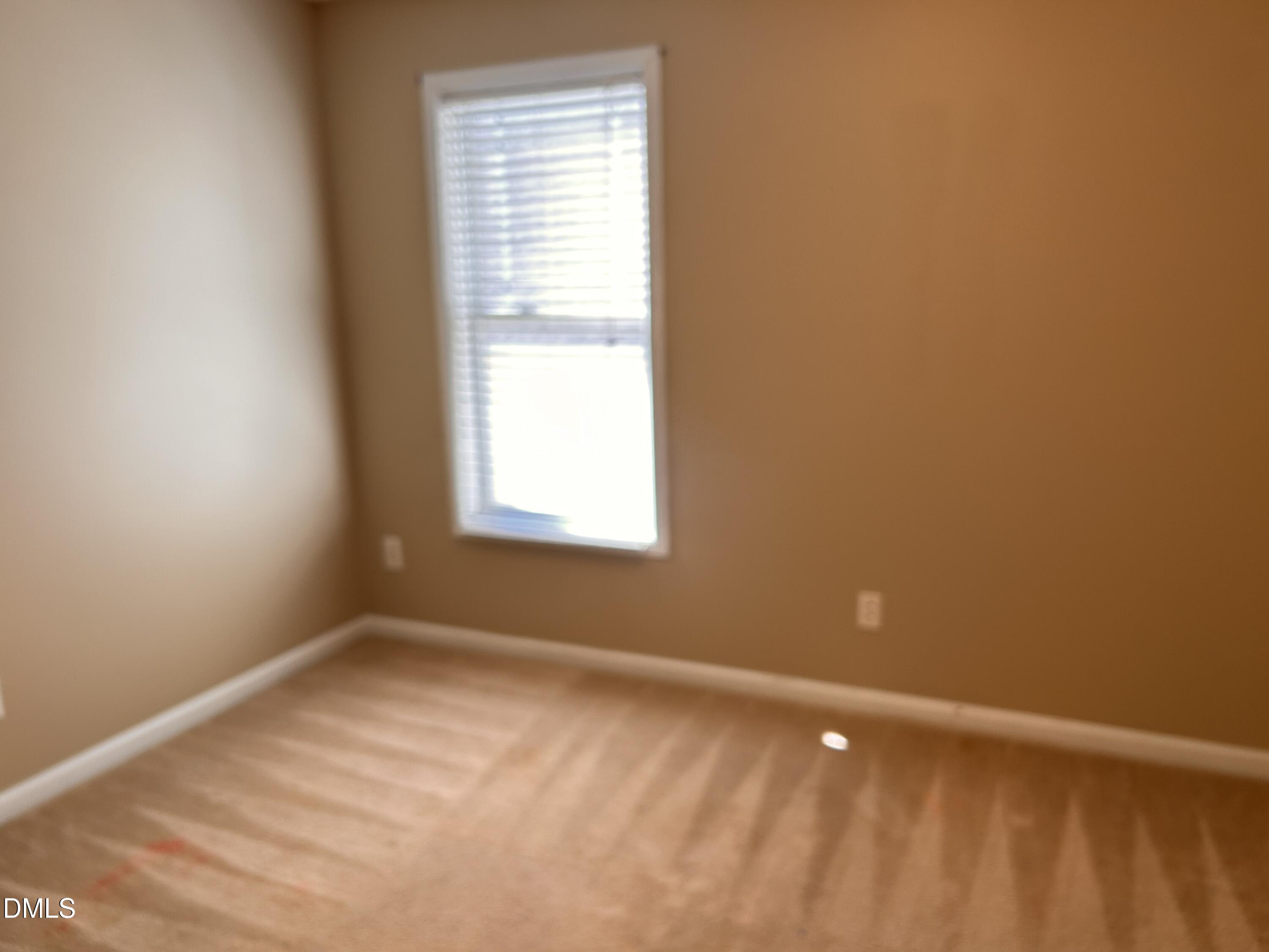 3920 Cane Garden Drive Raleigh, NC 27610 - Photo 17 of 23 a view of an empty room with a window