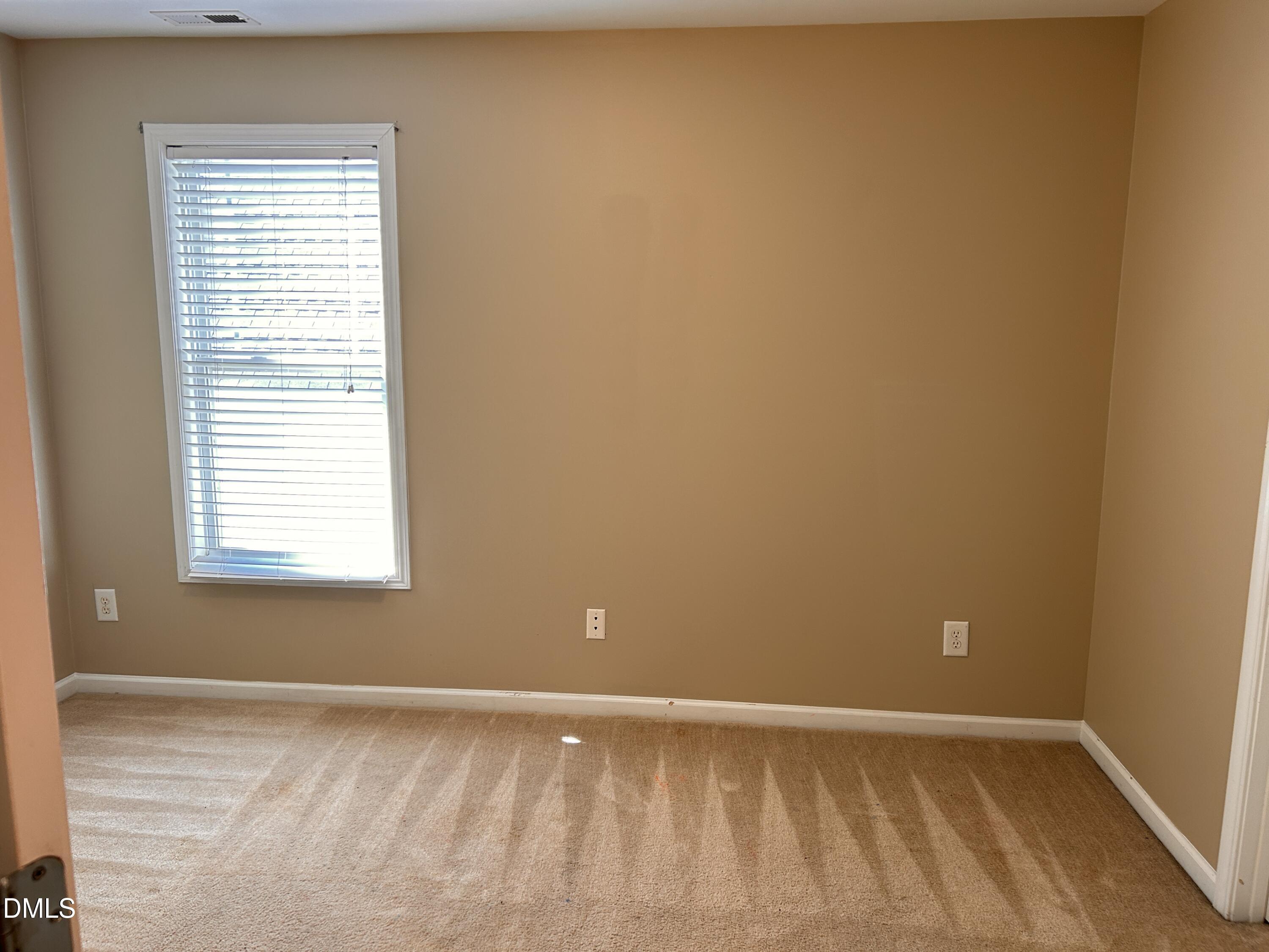 3920 Cane Garden Drive Raleigh, NC 27610 - Photo 19 of 23 a view of an empty room with a window