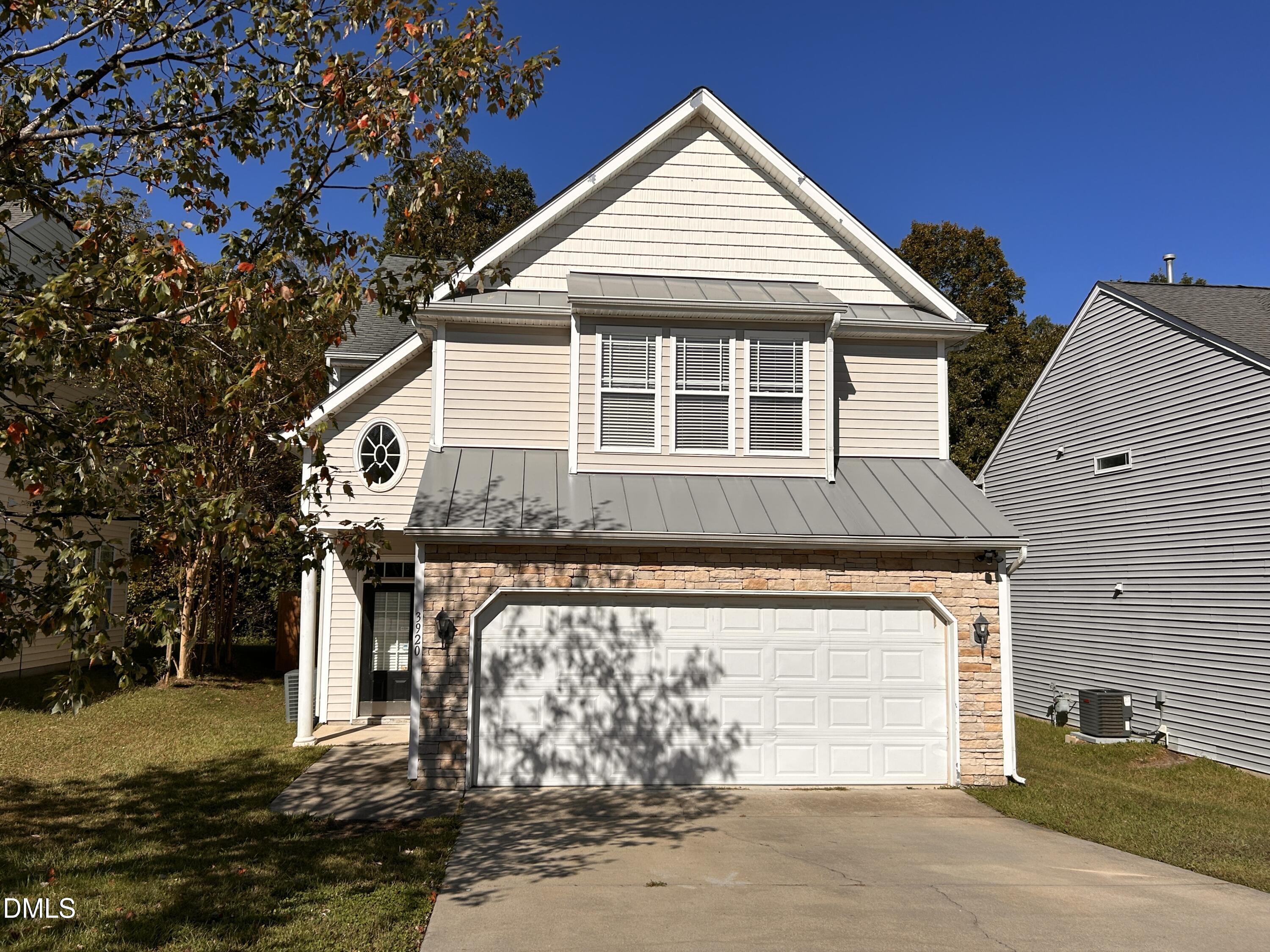 3920 Cane Garden Drive Raleigh, NC 27610 - Photo 2 of 23 a front view of a house with a yard