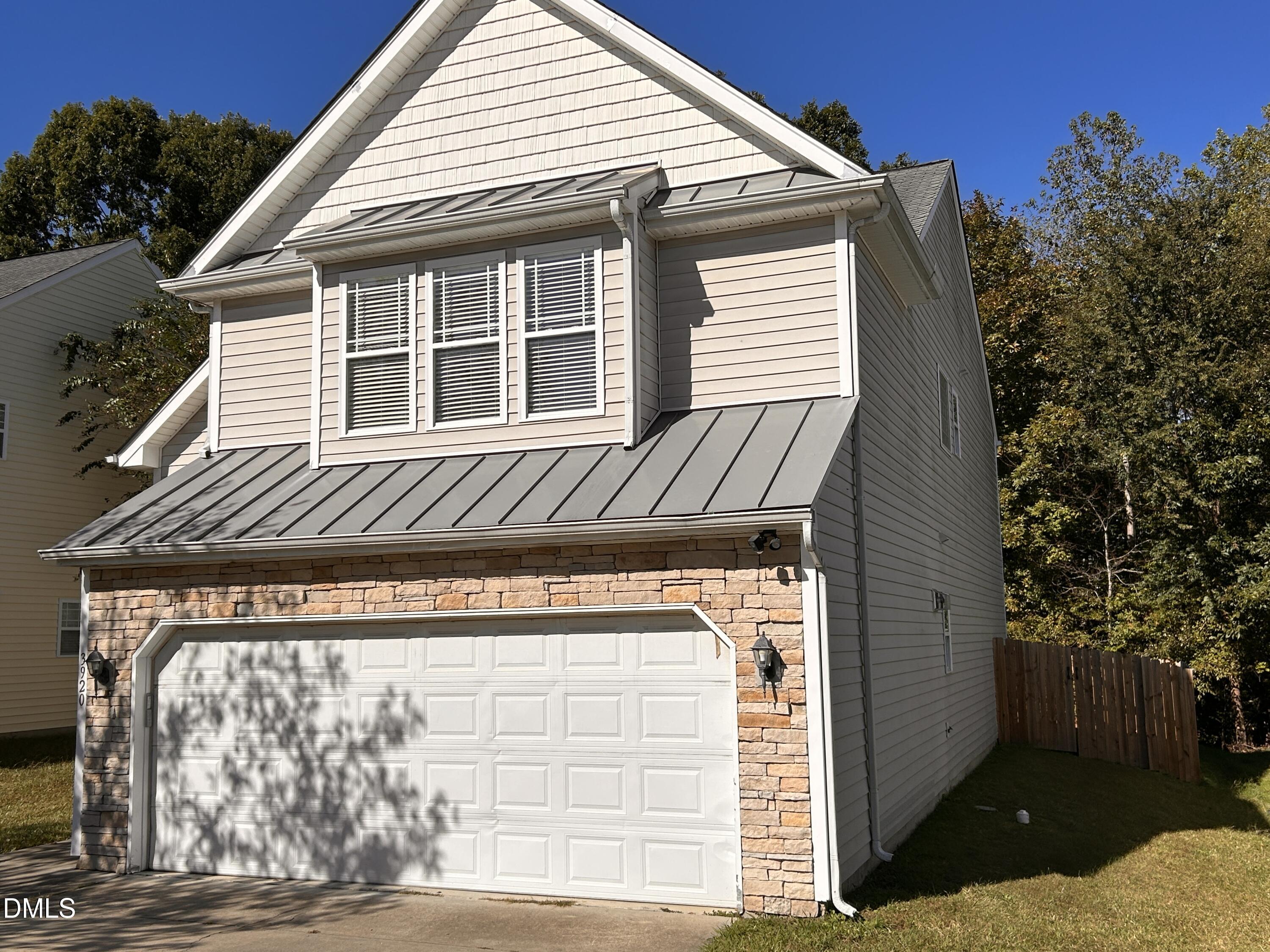 3920 Cane Garden Drive Raleigh, NC 27610 - Photo 23 of 23 a view of a house with a door and a window