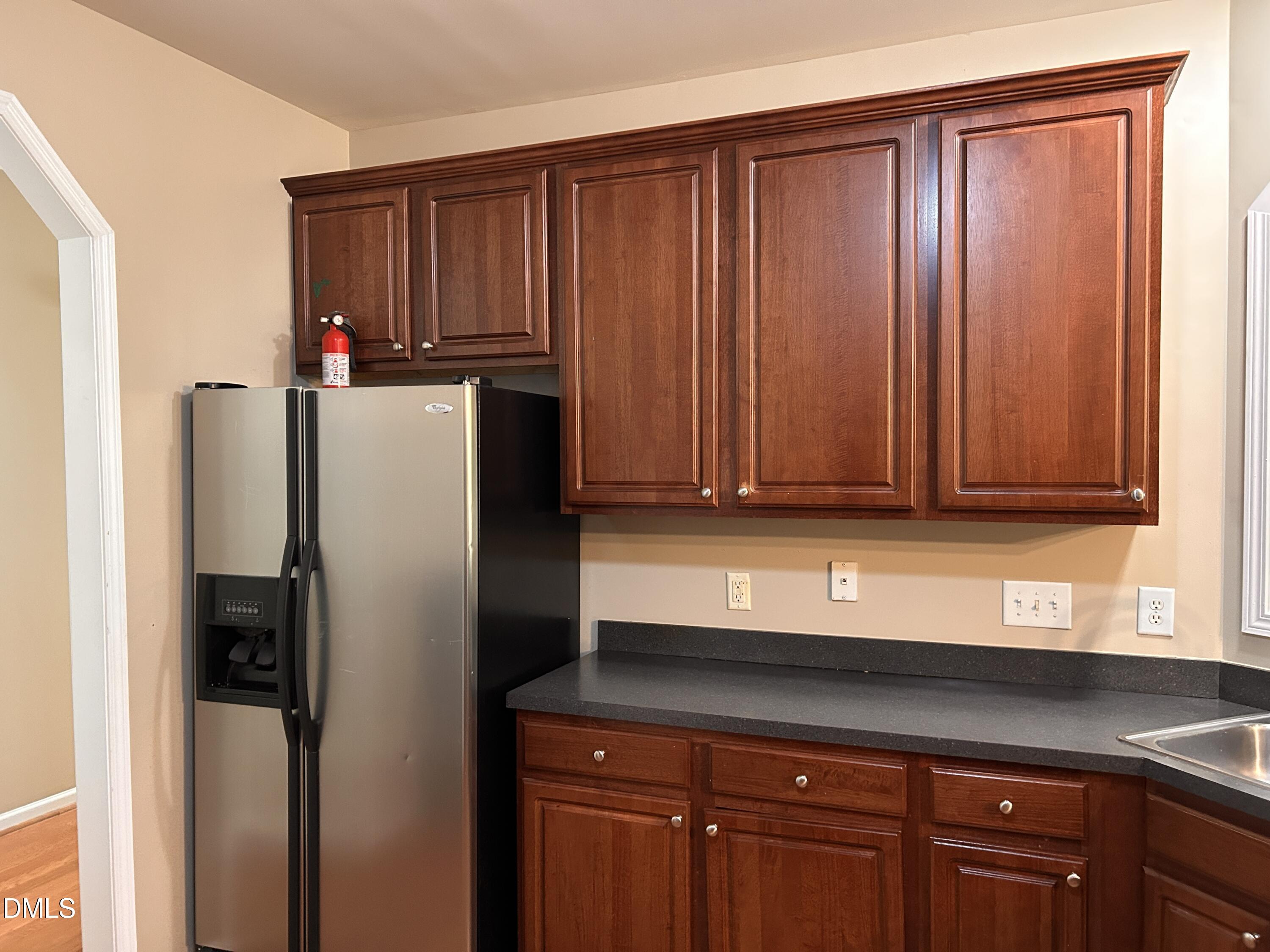3920 Cane Garden Drive Raleigh, NC 27610 - Photo 9 of 23 a kitchen with stainless steel appliances granite countertop a refrigerator and a sink