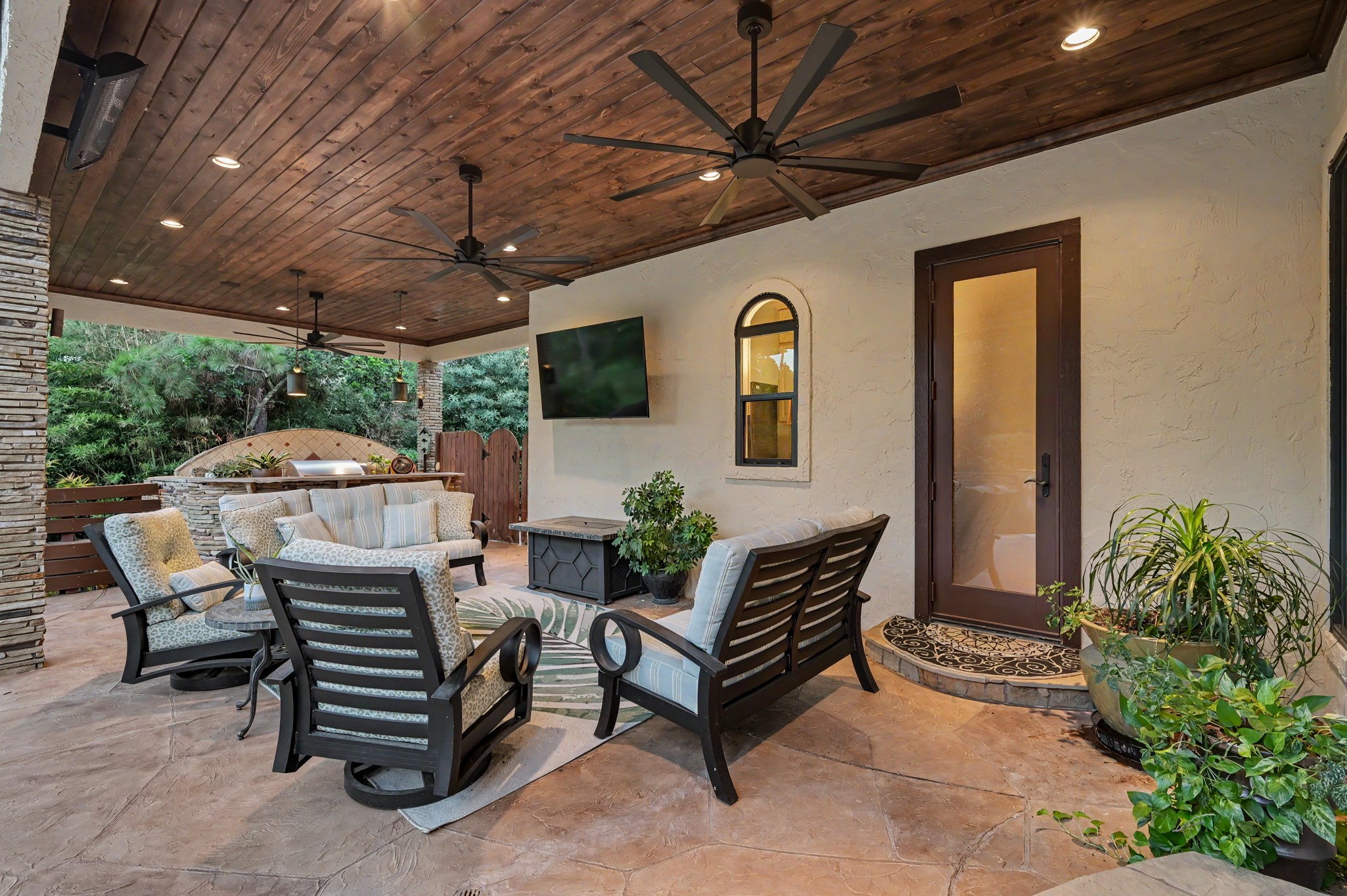 22 Watertree Court Spring, TX 77380 - Photo 15 of 45 Expansive covered outdoor living area featuring: multiple ceiling fans, outdoor heat radiators and generous space for relaxing and entertaining year-round.