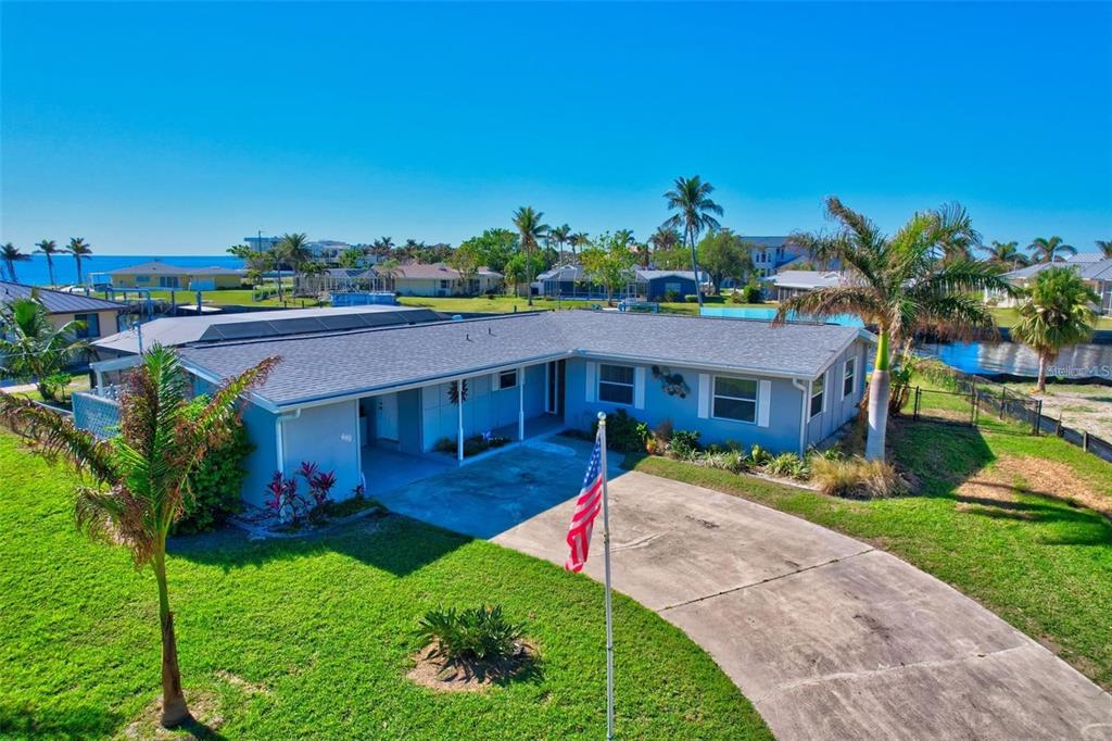 250 Bangsberg Road Southeast Port Charlotte, FL 33952 - Photo 2 of 59 a view of a house with a yard
