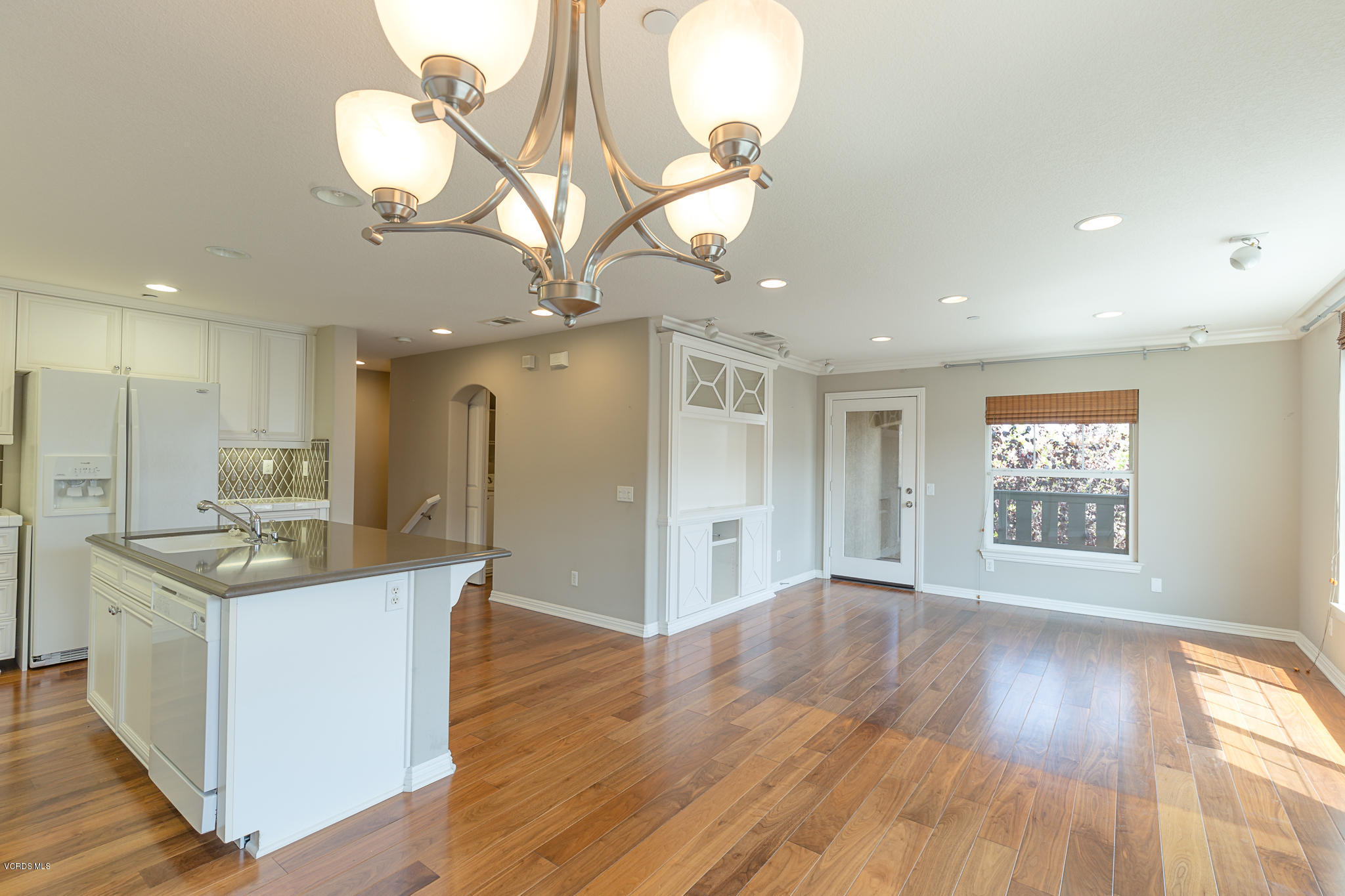 550 Southampton Place Oxnard, CA 93035 - Photo 2 of 12 a view of an empty room with wooden floor and a window