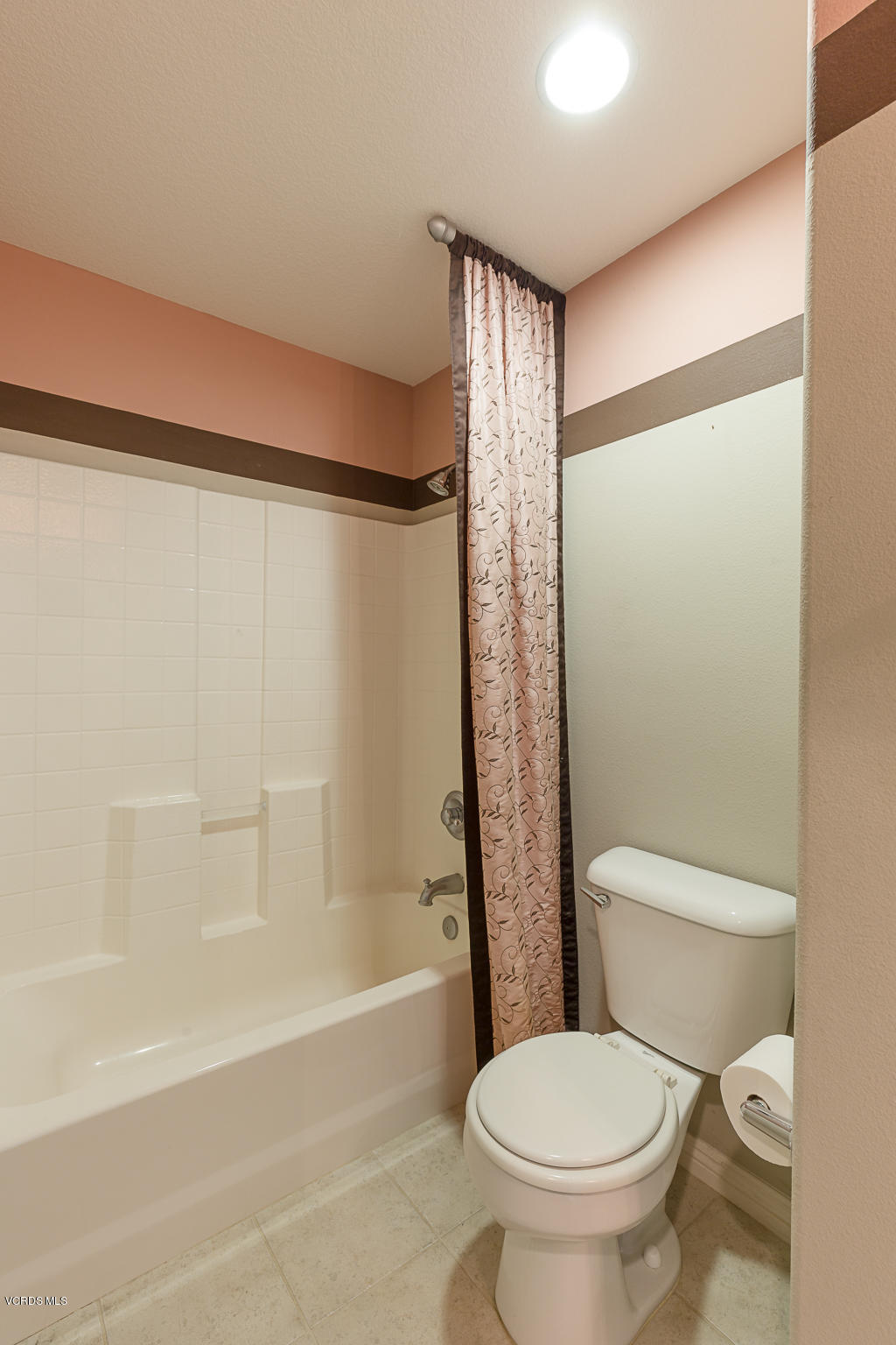 550 Southampton Place Oxnard, CA 93035 - Photo 7 of 12 a white toilet sitting next to a bath tub and a shower