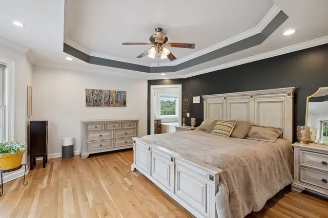 a bedroom with bed and a window