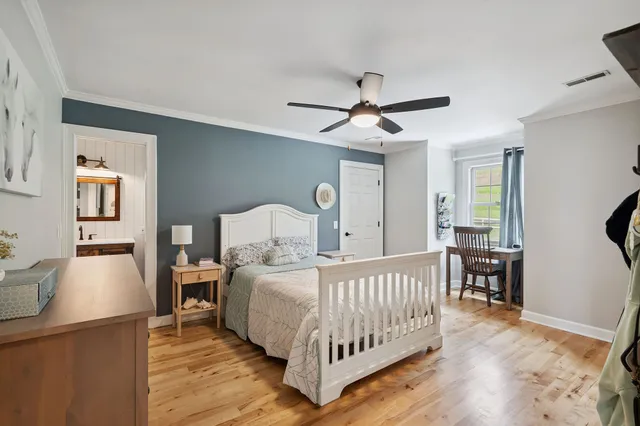 a bedroom with furniture and a window
