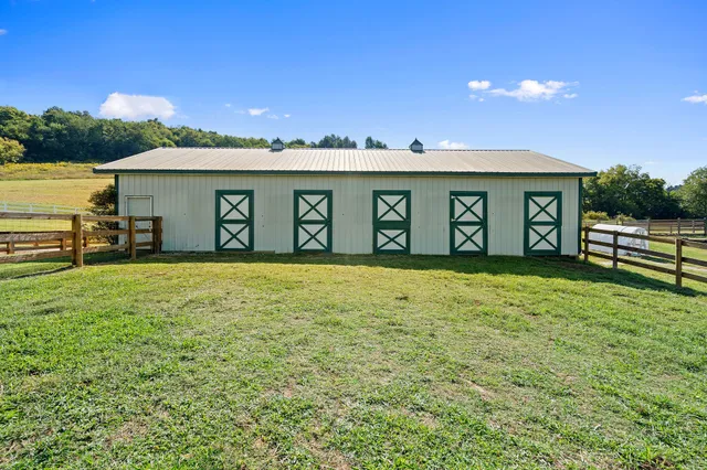 a view of two chairs and a table in a yard