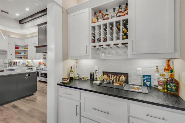 a kitchen with stainless steel appliances granite countertop a sink dishwasher stove and cabinets