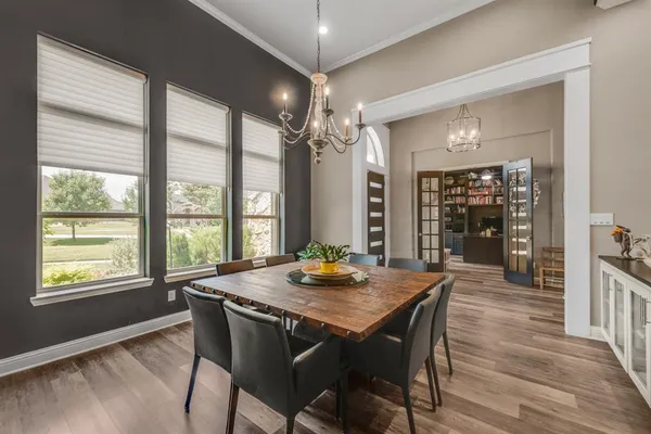 a dining room with furniture and window