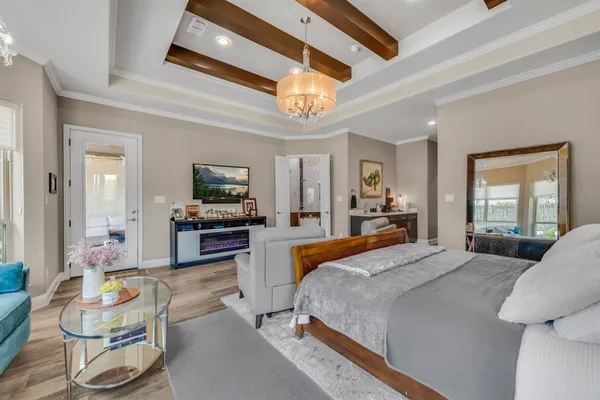 a spacious bathroom with a granite countertop sink a toilet a mirror and shower