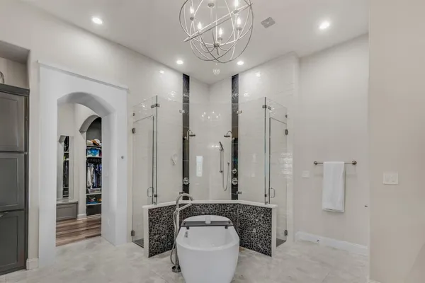 a spacious bathroom with a double vanity sink double and mirror