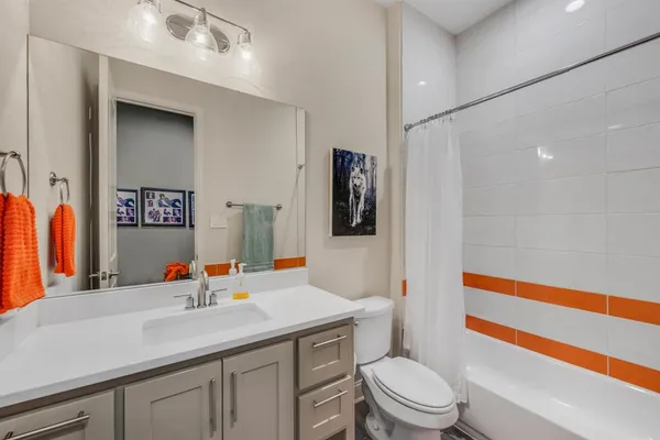 a utility room with cabinets washer and dryer