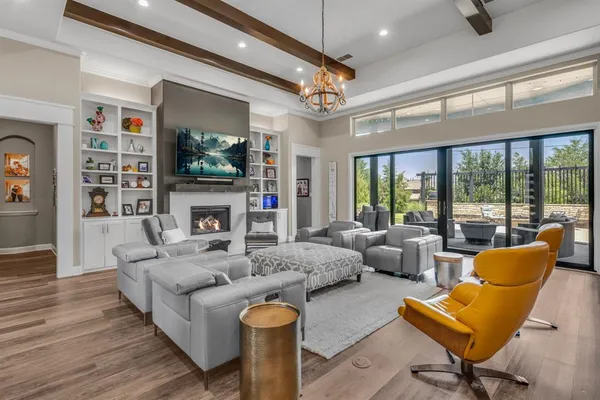 a living room with fireplace furniture and a flat screen tv