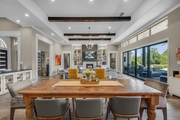 a dining room with a table chairs and wooden floor
