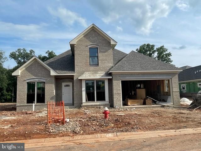 43041 Greeley Square Ashburn, VA 20148 - Photo 1 of 13 a front view of a house with garden