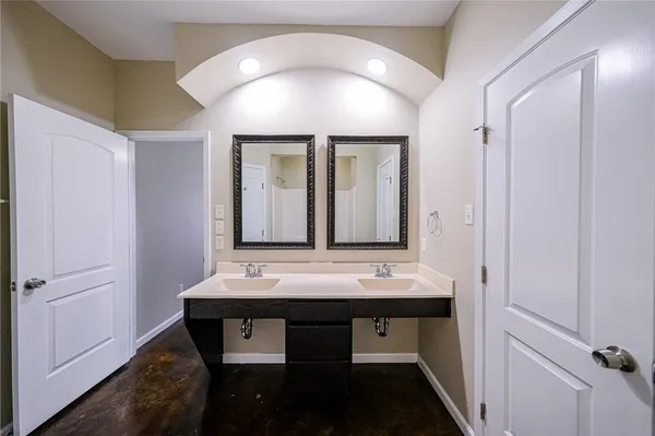 a bathroom with a sink a vanity and a mirror