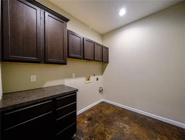 a bathroom with a granite countertop sink and cabinets