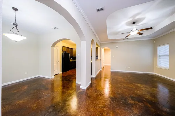 a view of an entryway with a chandelier fan