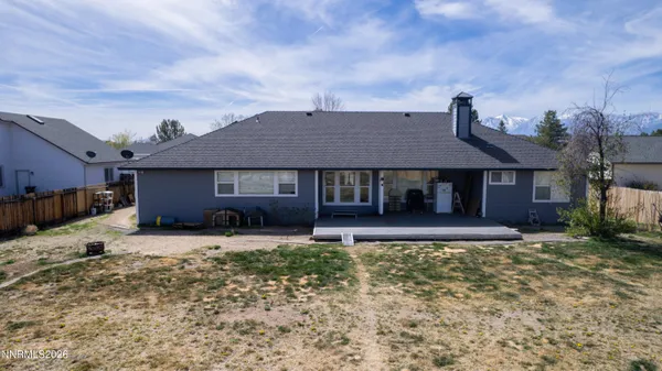 a house view with a sitting space and garden