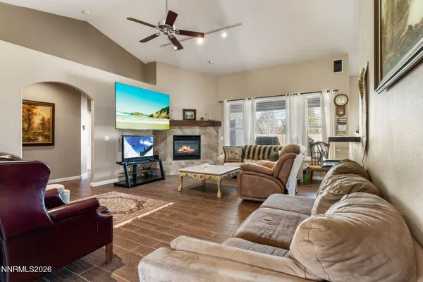 a living room with furniture fireplace and a fireplace