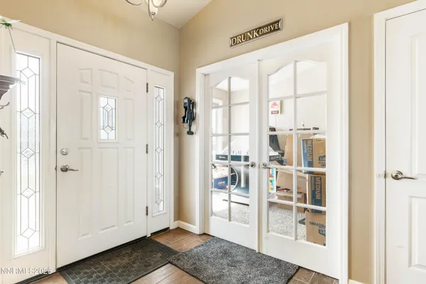 a view of front door with wooden floor