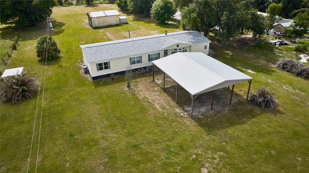 2701 Murphy Road Ona, FL 33865 - Photo 29 of 41 a aerial view of a house with swimming pool having outdoor seating
