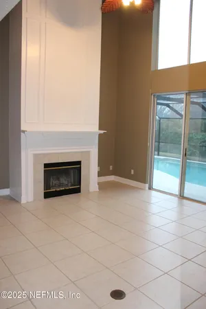 a view of an empty room with a fireplace