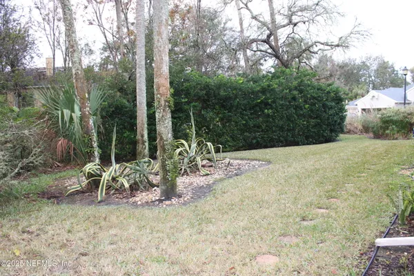 a view of a yard with patio
